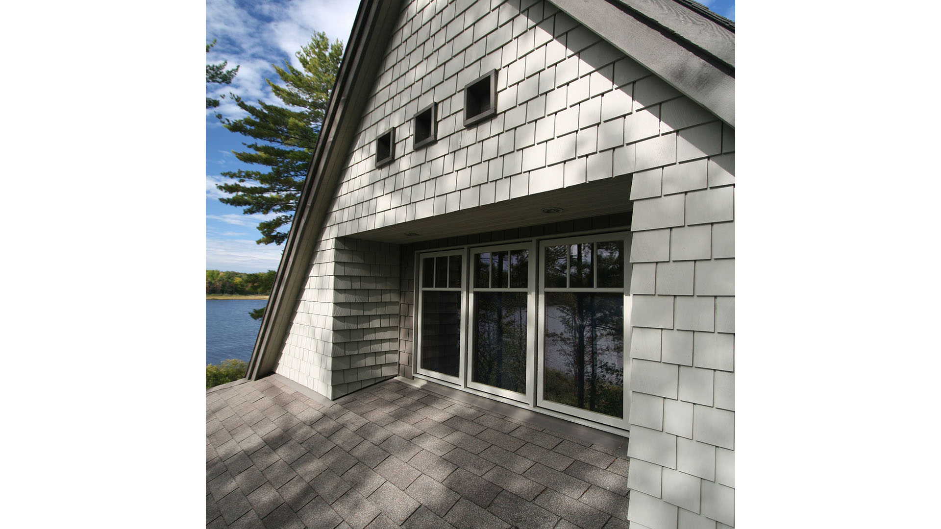 architect designed lakefront home - muskoka - recessed windows upper gable